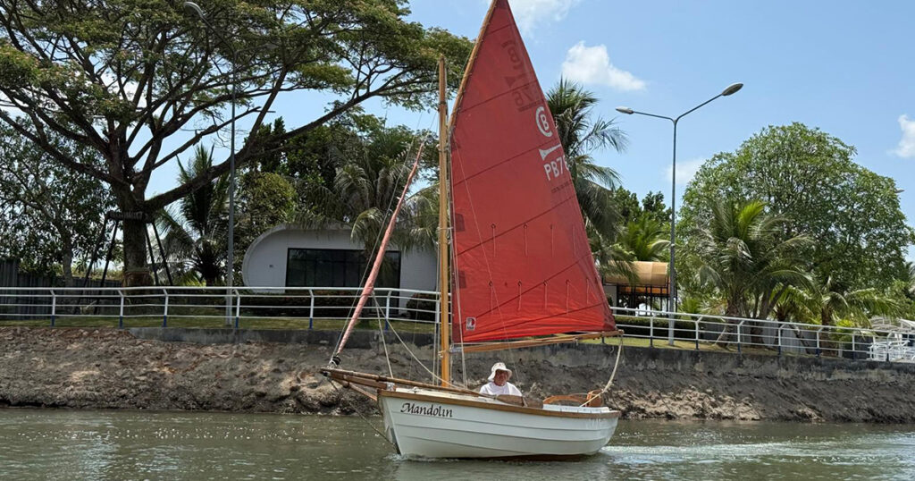 Post Boat Mandolin passing the lagoon waterfront in Krabi